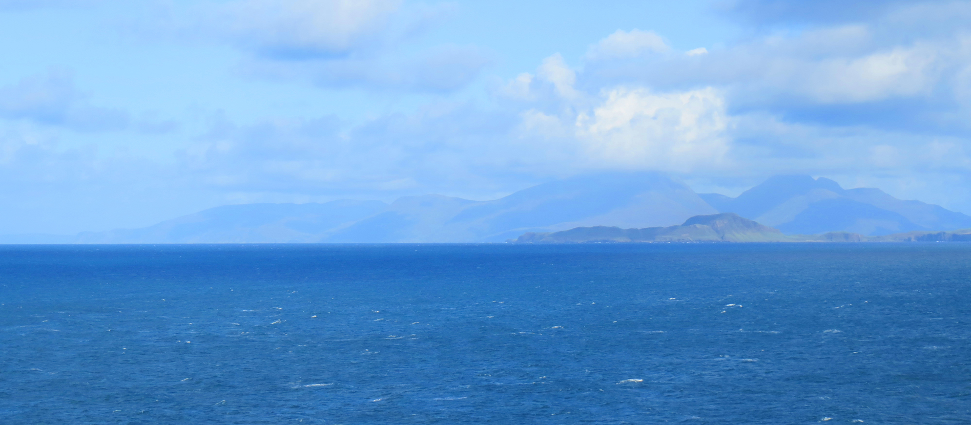 the-isle-of-eigg-with-rum-isle-in-the-background-from-sanda-bay