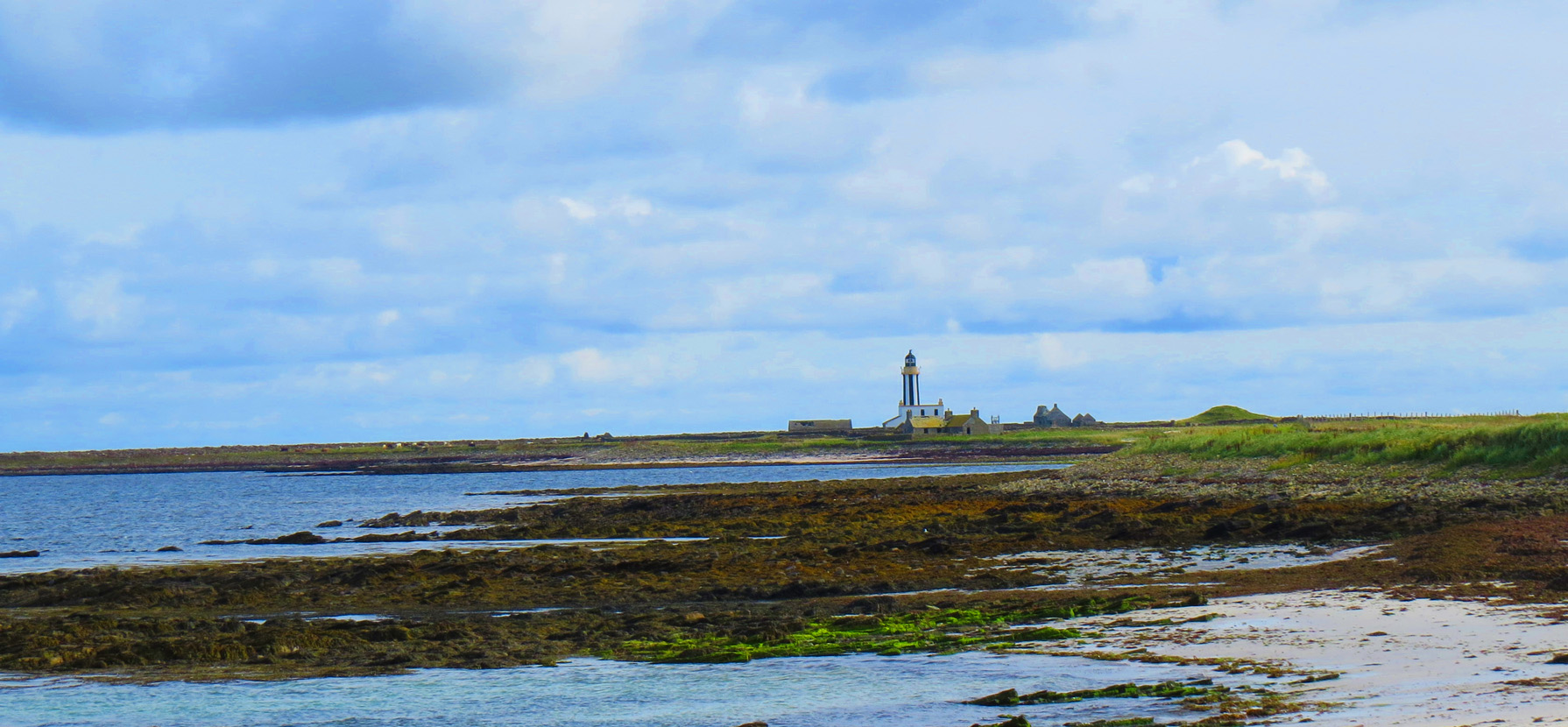 lighthouse and buried cottage on sanday
